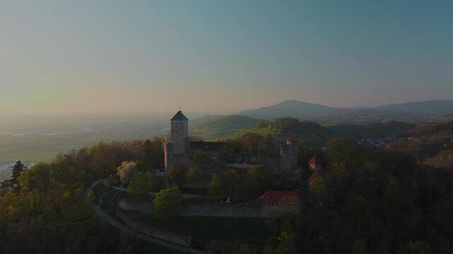 4K Drone Orbiting and Pulling Back from Historic Starkenburg Castle at Golden Hour Sunset