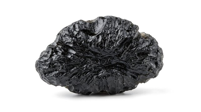 A natural black moldavite tektite gemstone specimen with a textured surface isolated on white background
