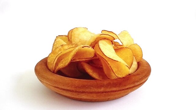 delicious cassava chips in a bowl isolated on white