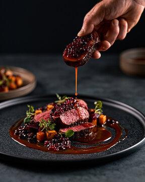 Avant-garde venison dish combining artistic plating, seasonal ingredients and contemporary fine dining aesthetics.