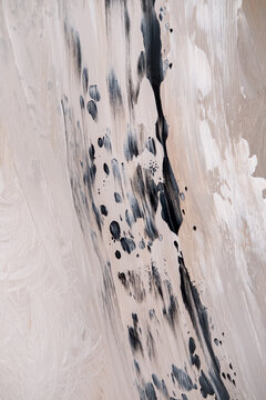 Art wall. Abstract painting. Background with black beige gray color acrylic ink strokes blending on canvas modern design.