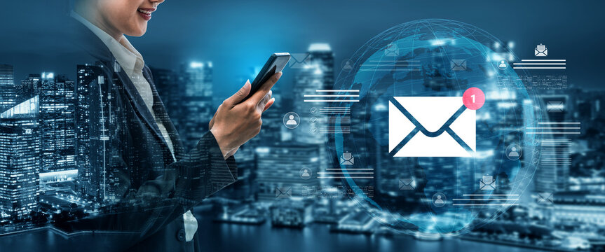 A professional woman engages with her smartphone in a vibrant city at night. The glowing email icon highlights the importance of digital communication and networking today. Cyphers