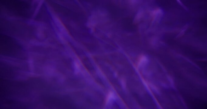 Defocused radiant light. Rainbow texture. Purple red blue colorful optical dazzle flash on abstract illuminated visual art background.