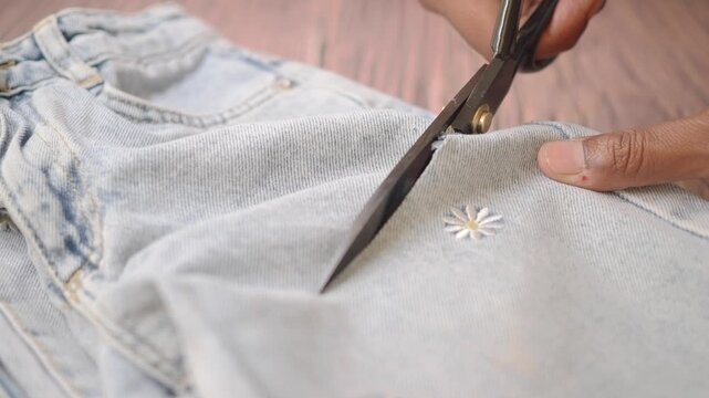 Cutting jeans to make a new design