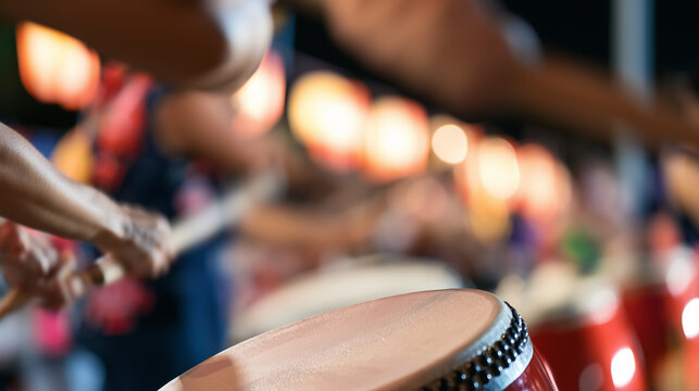 Close up action of traditional taiko drummers performing at the vibrant Oeshiki Festival event