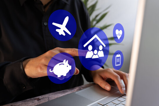 Person touches icons for travel, housing, healthcare, and savings on laptop
