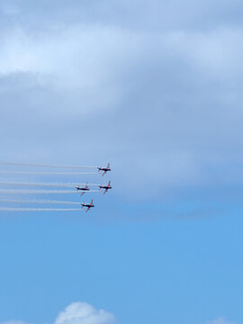 Aerobatic Display Planes Flying in Formation with Smoke Trails