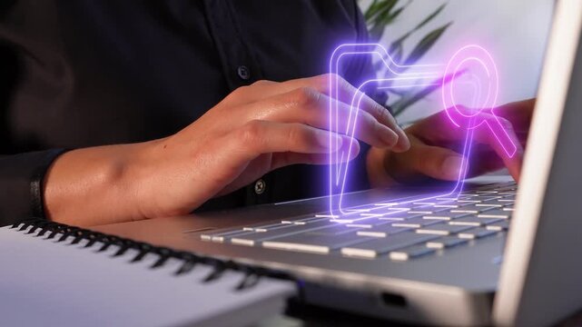 Reviewing digital documents. Close-up of a professional woman's hands using a computer, showing a virtual folder icon and a magnifying glass.