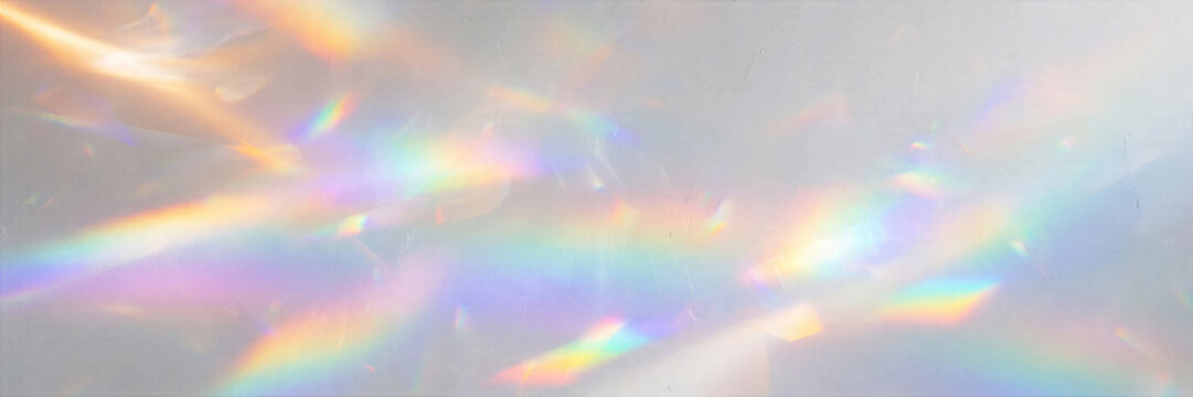 Ethereal light leak abstraction soft rainbow prism reflections clean white studio wall texture banner