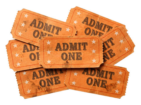 A pile of vintage orange admit one tickets for cinema or event entry on a white background