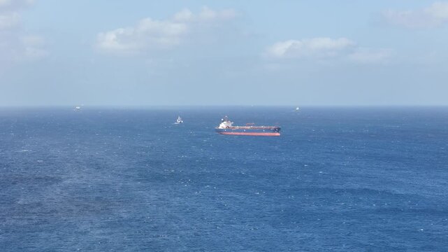 chemical tanker cargo ship open sea malta aerial drone shipping industry maritime trade blue water horizon distant vessels offshore logistics global trade
