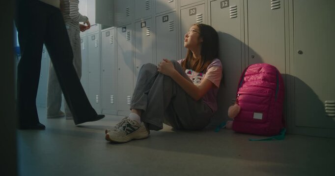 Concerned Teacher Reaches Out to Lonely Teenage Student Sitting Beside School Lockers. Adolescent Challenges, Emotional Care, School Guidance, Positive Teacher Intervention in Everyday School Life.