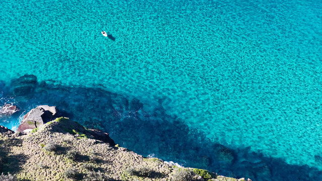 Aerial View of a Small Boat in Turquoise Water at Crescent Head