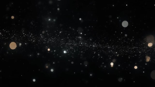 Enhance your creative projects with this magical glowing gold and silver bokeh particle dust effect on a dark background. Perfect for celebrations and holiday videos.
