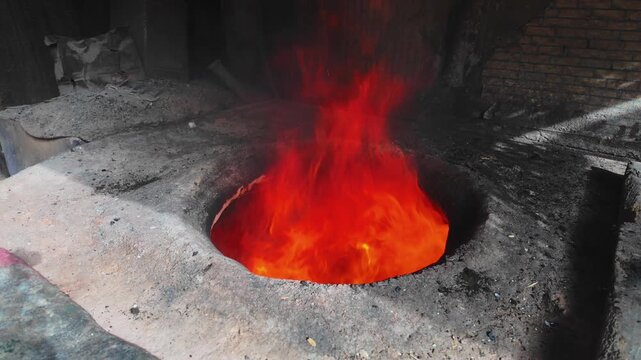 Traditional Tandoor Oven Burning Outside a Bakery in Kashgar