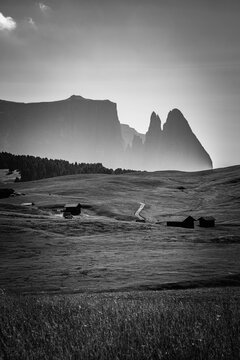 Black and White of Sciliar Mountain Silhouette Above the Rolling Meadows of Alpe di Siusi - Dolomites, Italy