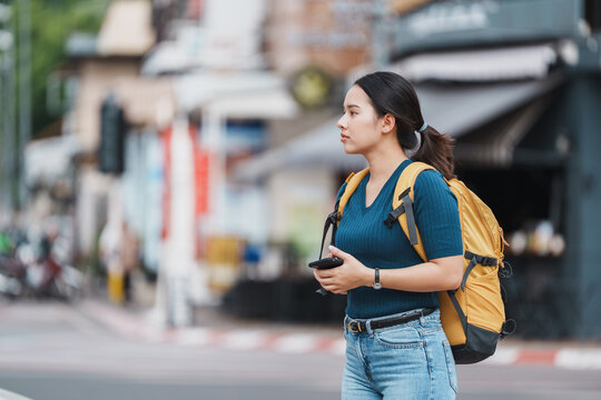 Young woman traveling street exploring urban city