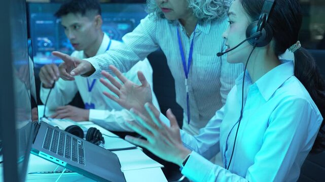 Professional female operator analyzing flight data and radar interface in airport control tower