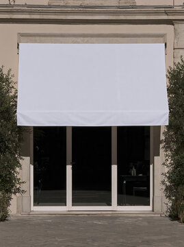 Beauty salon exterior with white fabric awning and glass entrance