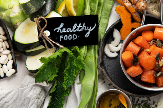 Fresh vegetables, fruits, beans and nuts. Food cooking background.
