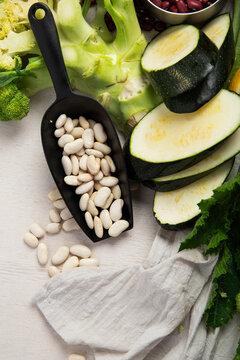 Fresh vegetables, fruits, beans and nuts. Food cooking background.