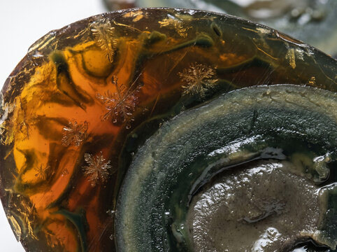 Macro closeup of Chinese century preserved egg showing amber gelatin pine needle snowflake crystals