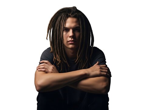 A portrait of a young man with dreadlocks against a plain white background