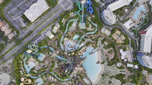7th of July 2026 drone flight above the Volcano Bay water park with volcano, pools, slides and nearby highway traffic in Orlando, Florida, USA. g.