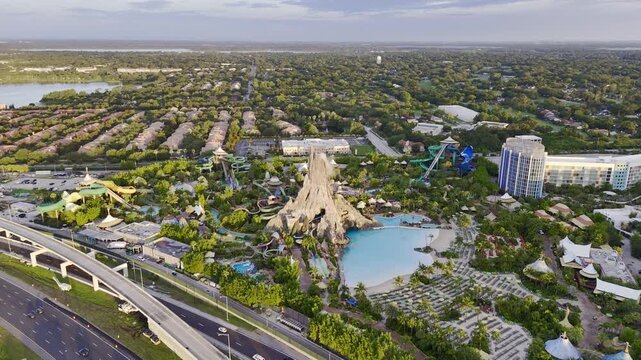 7th of July 2026 drone flight above the Volcano Bay water park with volcano, pools, slides and nearby highway traffic in Orlando, Florida, USA. g.