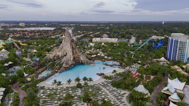 7th of July 2026 drone flight above the Volcano Bay water park with volcano, pools, slides and nearby highway traffic in Orlando, Florida, USA. g.