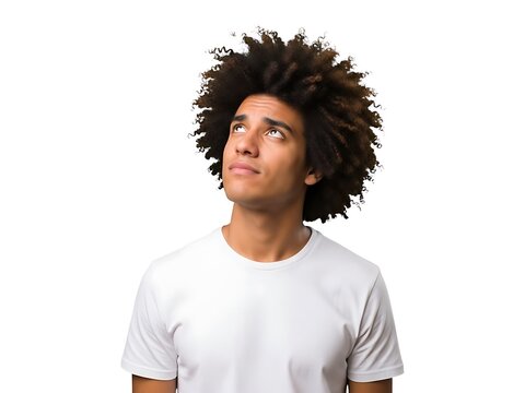 A young man with an afro hairstyle looking upward against white background