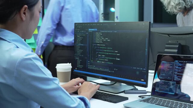Cybersecurity programmers brainstorming secure data storage and network systems, protecting business technology through advanced IT infrastructure and digital security.