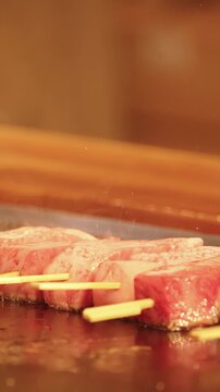 Japanese Wagyu Beef Skewers Grilling on Teppanyaki Flat Top