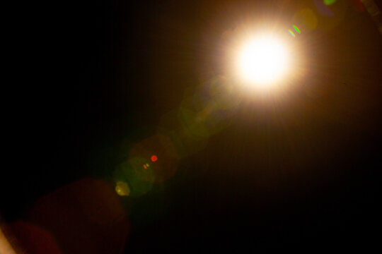 Sun flare on the black background