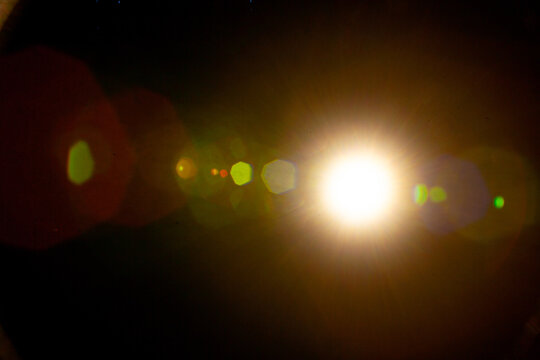 Sun flare on the black background