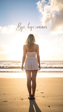 A woman stands on a beach at sunset, bidding farewell to summer.