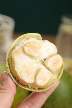 Fresh Luo Han Guo Monk Fruit Cut Open Showing Natural Sweet Flesh and Seeds