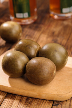 Golden Han Luo Guo Tea Eggs on Wooden Board - Traditional Chinese Cuisine Studio Photography
