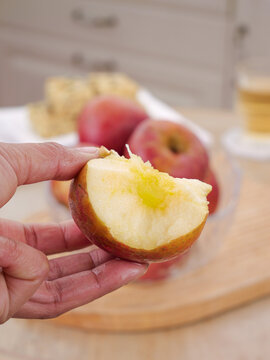 Fresh Apple Slice with Heart-Shaped Core in Hand - Healthy Fruit Snack from Daliangshan Yanyuan Region