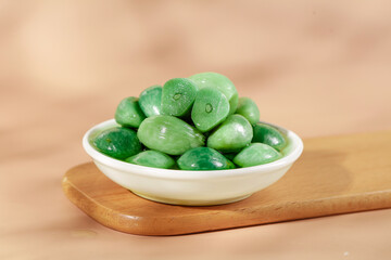 Fresh Green Olives in White Bowl on Wooden Board - Mediterranean Food Appetizer © ThachThi