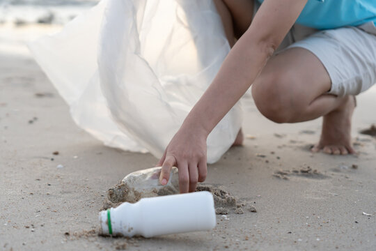 Save water. Volunteer pick up trash garbage at the beach and plastic bottles are difficult decompose prevent harm aquatic life. Earth, Environment, Greening planet, reduce global warming, Save world