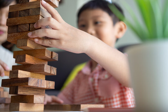 Happy Asian child playing and learning toy blocks. children are very happy and excited at home. child have a great time playing, activities, development, attention deficit hyperactivity disorder
