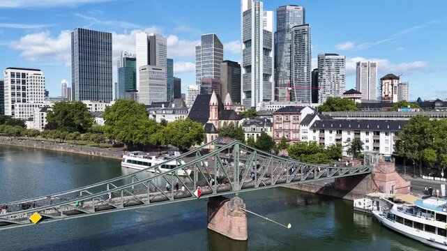 Iron Bridge In Frankfurt Am Main In Hessen Germany. Historical Bridge. Corporate Buildings. European Destination. Iron Bridge In Frankfurt Am Main In Hessen Germany. Tourism Landmark.