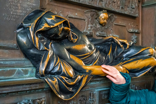 Tourists hands rub Statue of Everard Serclaes in Brussels Belgium brings luck and grants the wishes of all who touch it. Brussels, Belgium - October 28, 2025