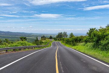 Naklejka premium Waimea Canyon Drive (Highway 550) is a 19-mile scenic mountain road on Kauai's west side that climbs from sea level to over 4,000 feet, offering access to dramatic overlooks