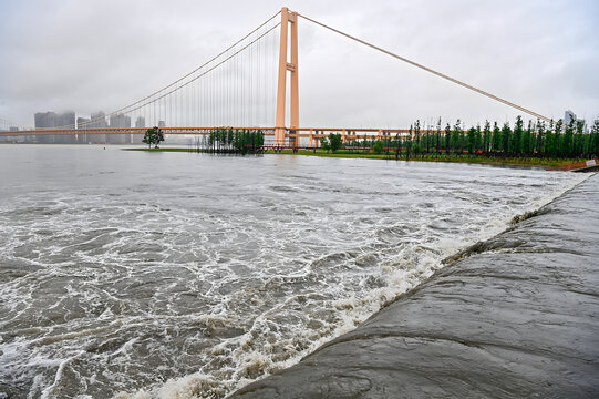 Yangsigang Bridge Spans Turbulent River Waters