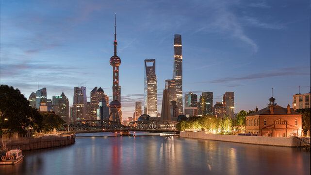 Shanghai Lujiazui skyline at dusk across Suzhou Creek, China