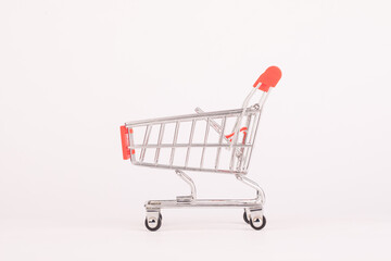 Mini shopping cart isolated on white background © PhamHong