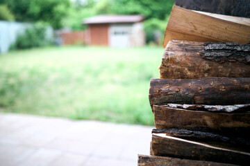 Naklejka premium Chopped firewood pile with rough cut surfaces