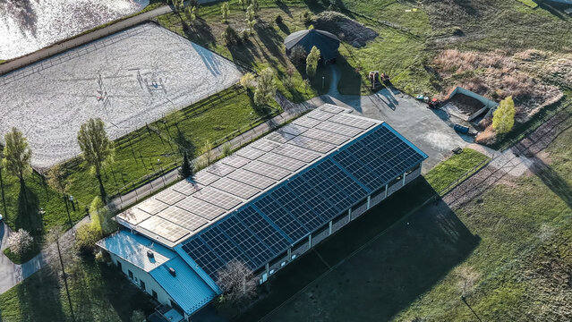 Aerial view of a large building with solar panels
